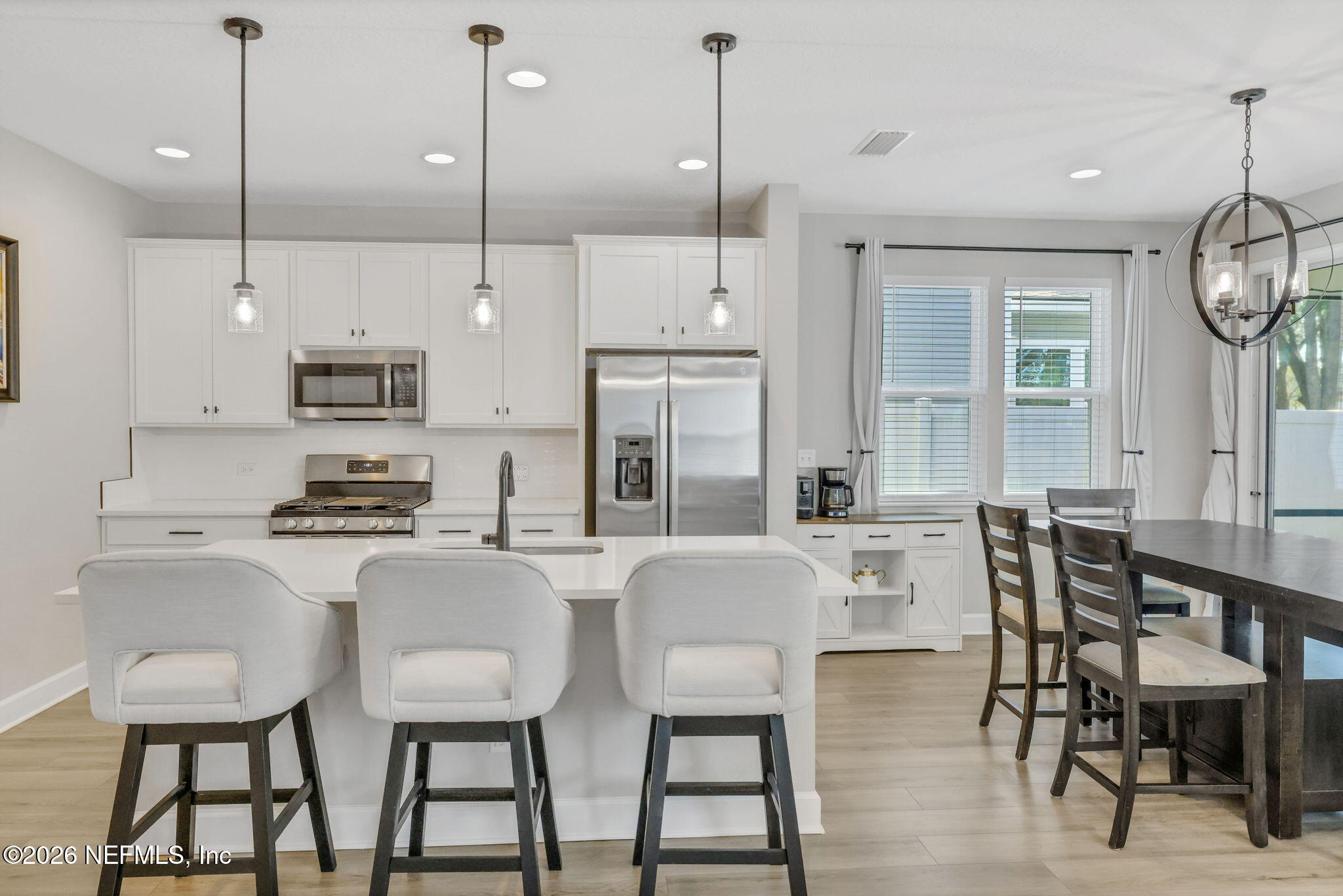 273 Little Bear Run St. Johns, FL 32259 - Photo 10 of 57 a large kitchen with a table and chairs