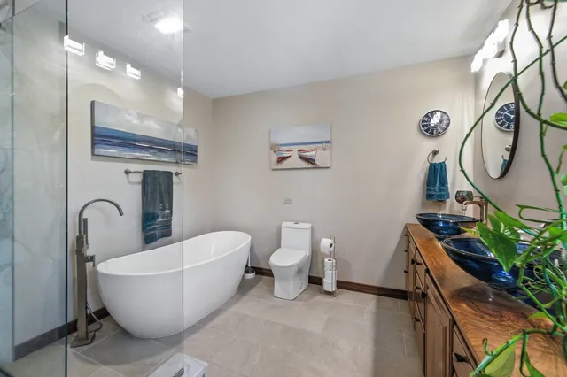 a bathroom with a shower and a glass door