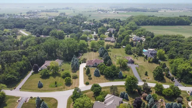 an aerial view of house with yard swimming pool and outdoor seating