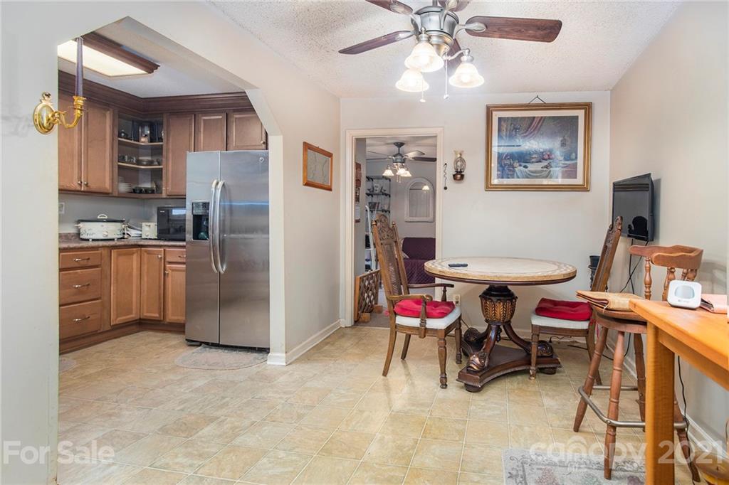 4635 Hickory Grove Road Sharon, SC 29742 - Photo 14 of 25 a workspace with furniture cabinet and a chandelier