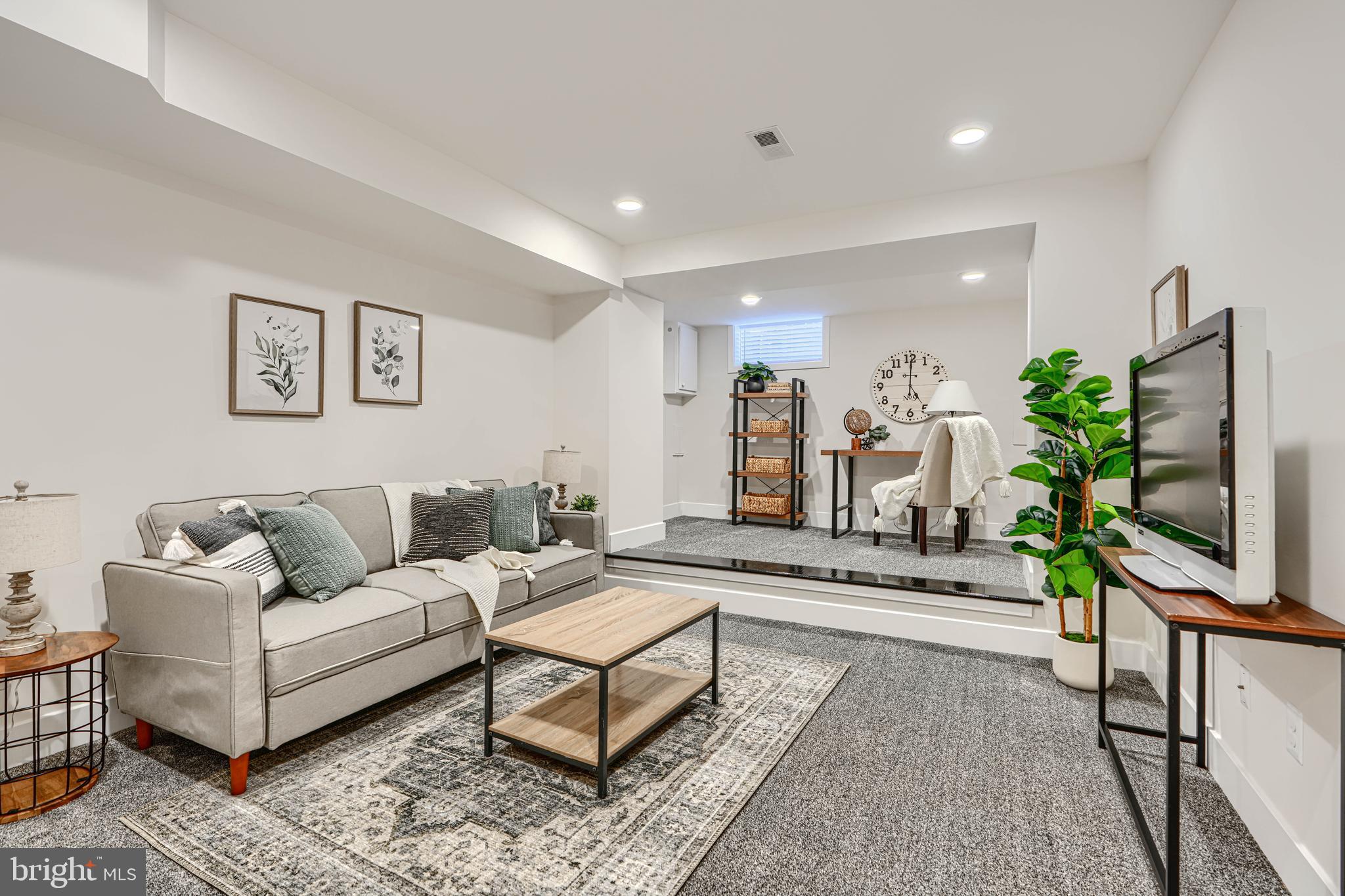 609 South Eaton Street Baltimore, MD 21224 - Photo 18 of 36 a living room with furniture and a flat screen tv