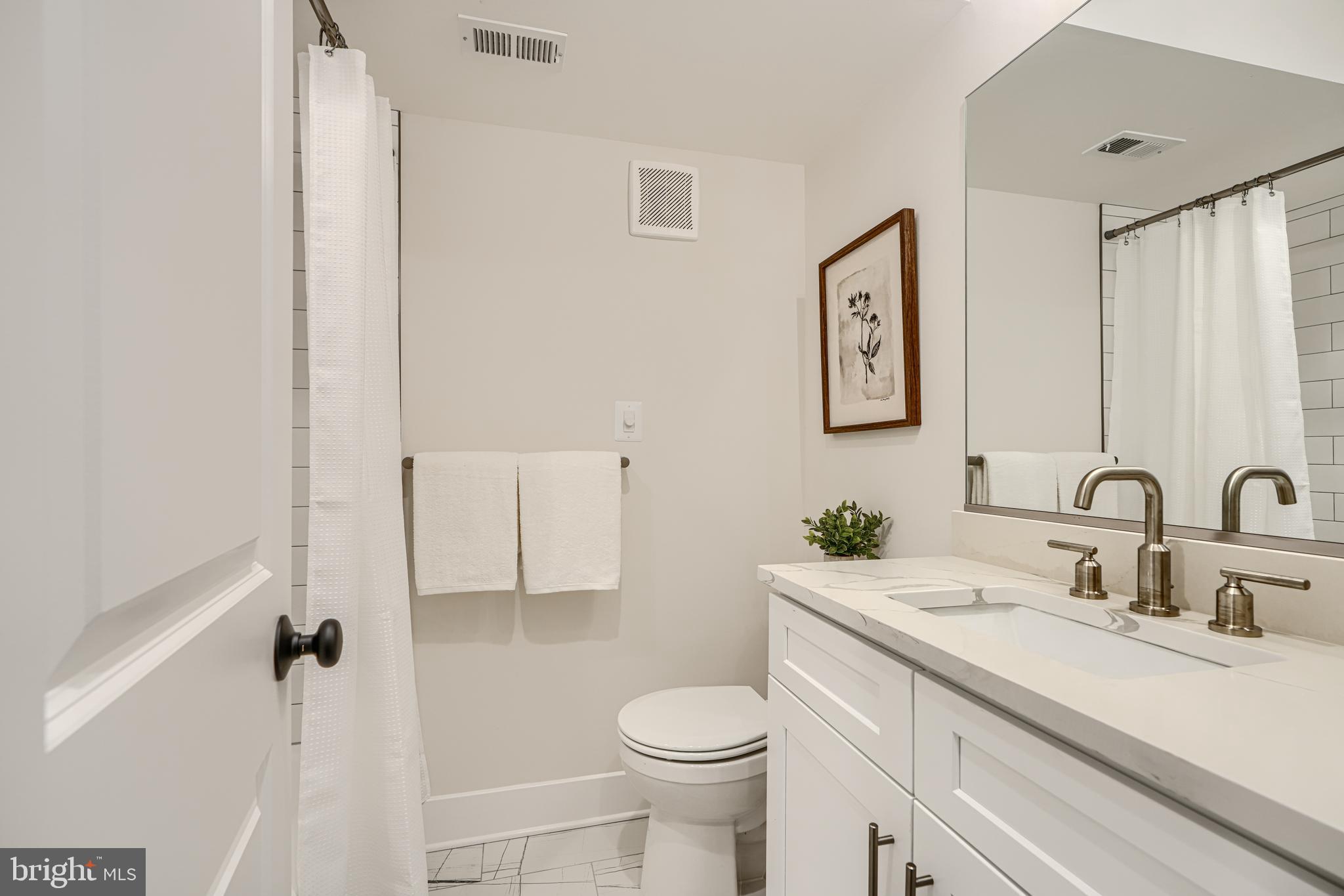 609 South Eaton Street Baltimore, MD 21224 - Photo 21 of 36 a bathroom with a sink toilet and shower