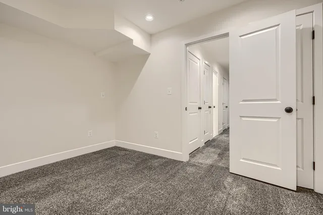 a room with a bed and a window