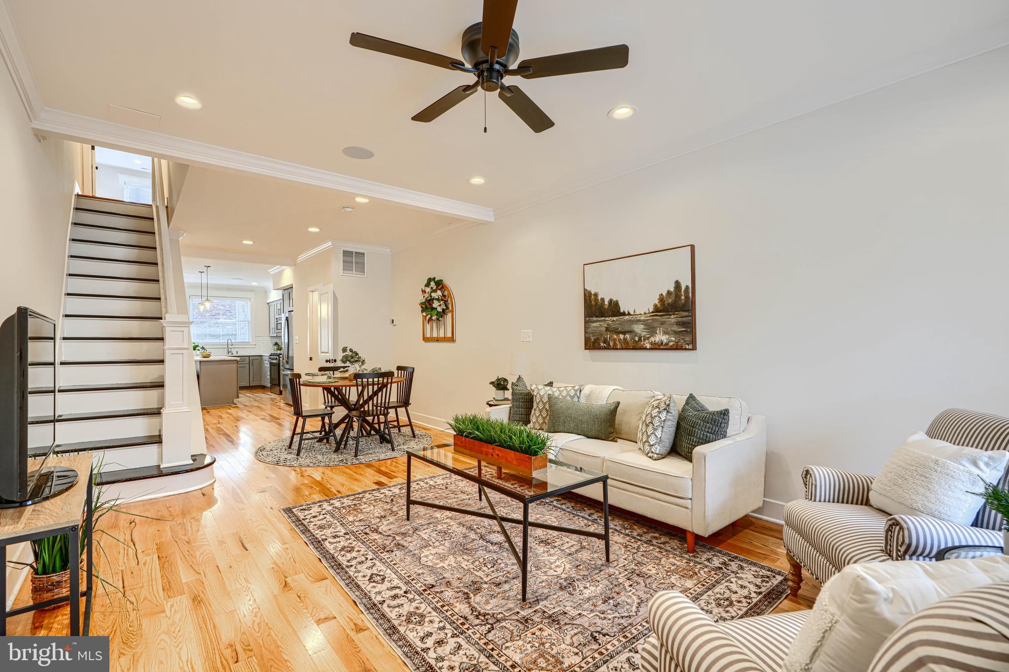 609 South Eaton Street Baltimore, MD 21224 - Photo 3 of 36 a living room with furniture and a wooden floor