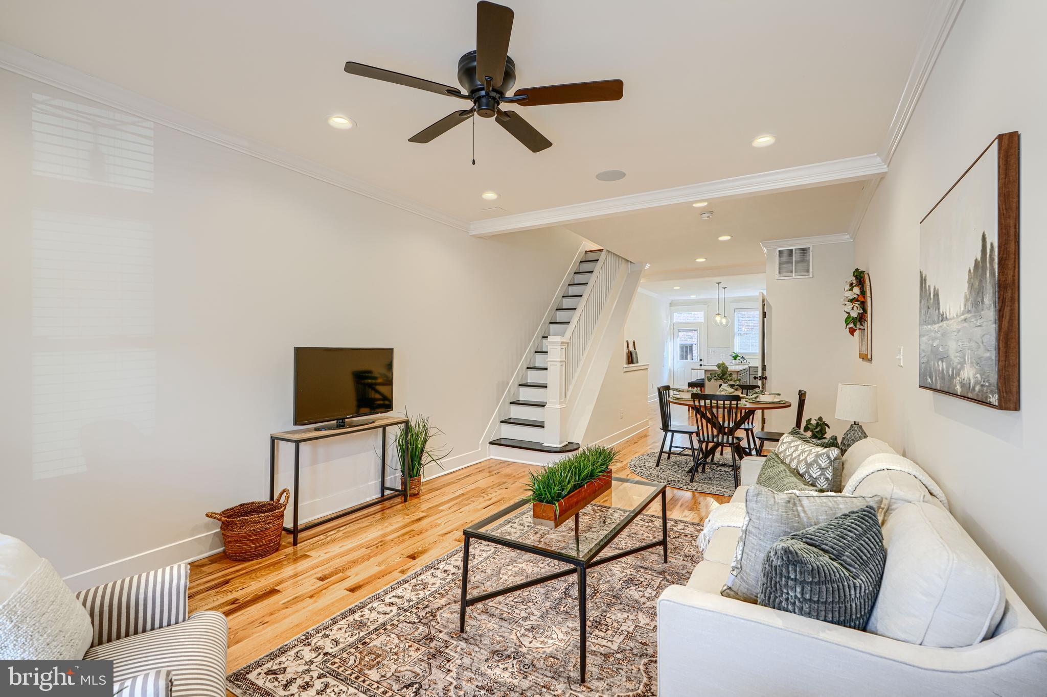 609 South Eaton Street Baltimore, MD 21224 - Photo 4 of 36 a living room with furniture and a flat screen tv