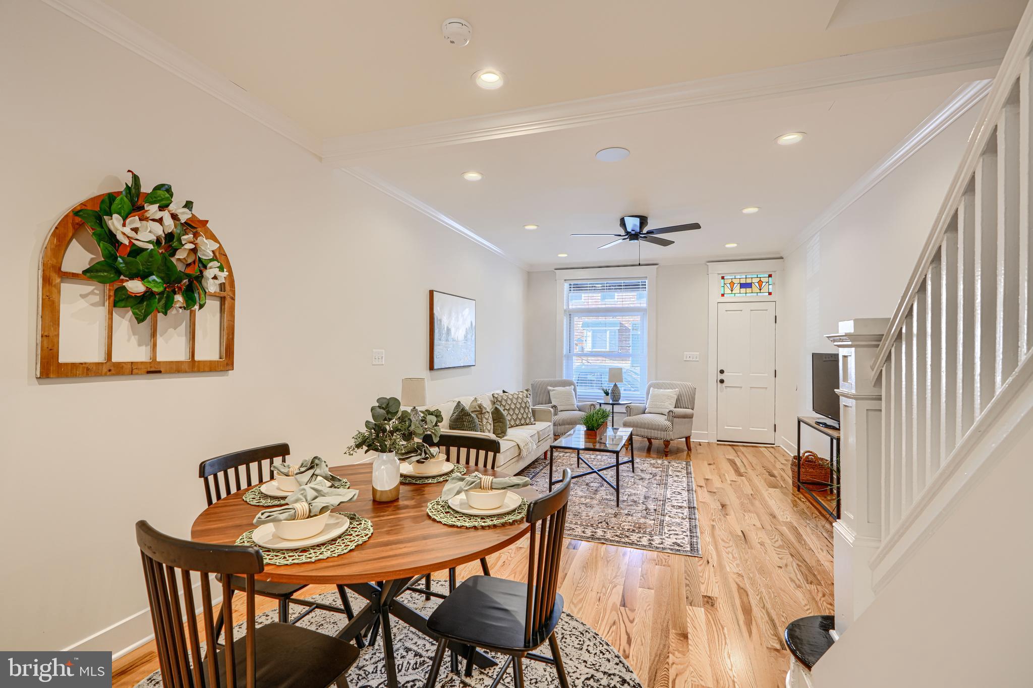 609 South Eaton Street Baltimore, MD 21224 - Photo 9 of 36 a view of a dining room with furniture and a potted plant