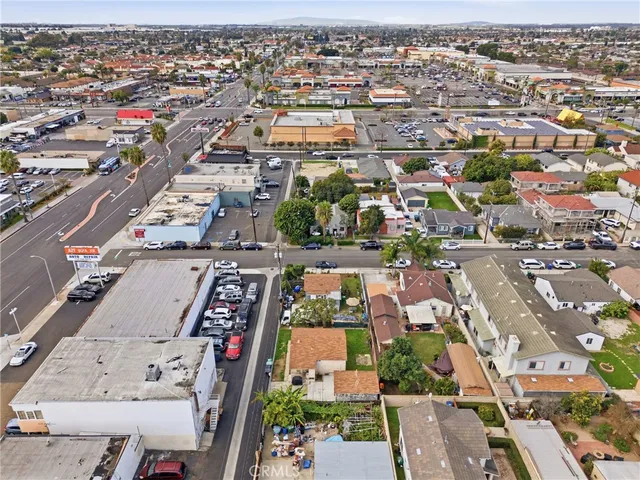 an aerial view of residential houses with city view
