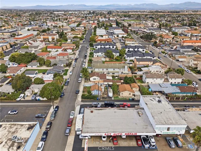 an aerial view of residential houses with green space