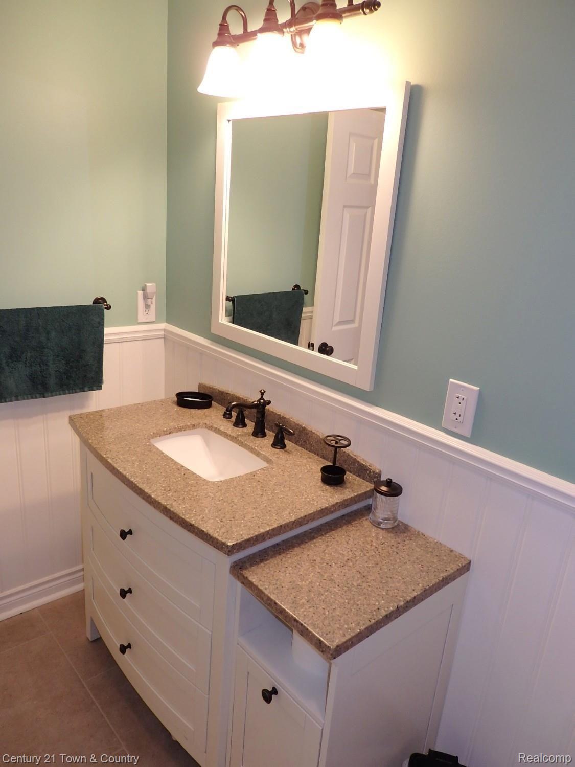242 Poco Court Rochester, MI 48307 - Photo 42 of 45 New vanity, fixtures, granite top and wainscoting