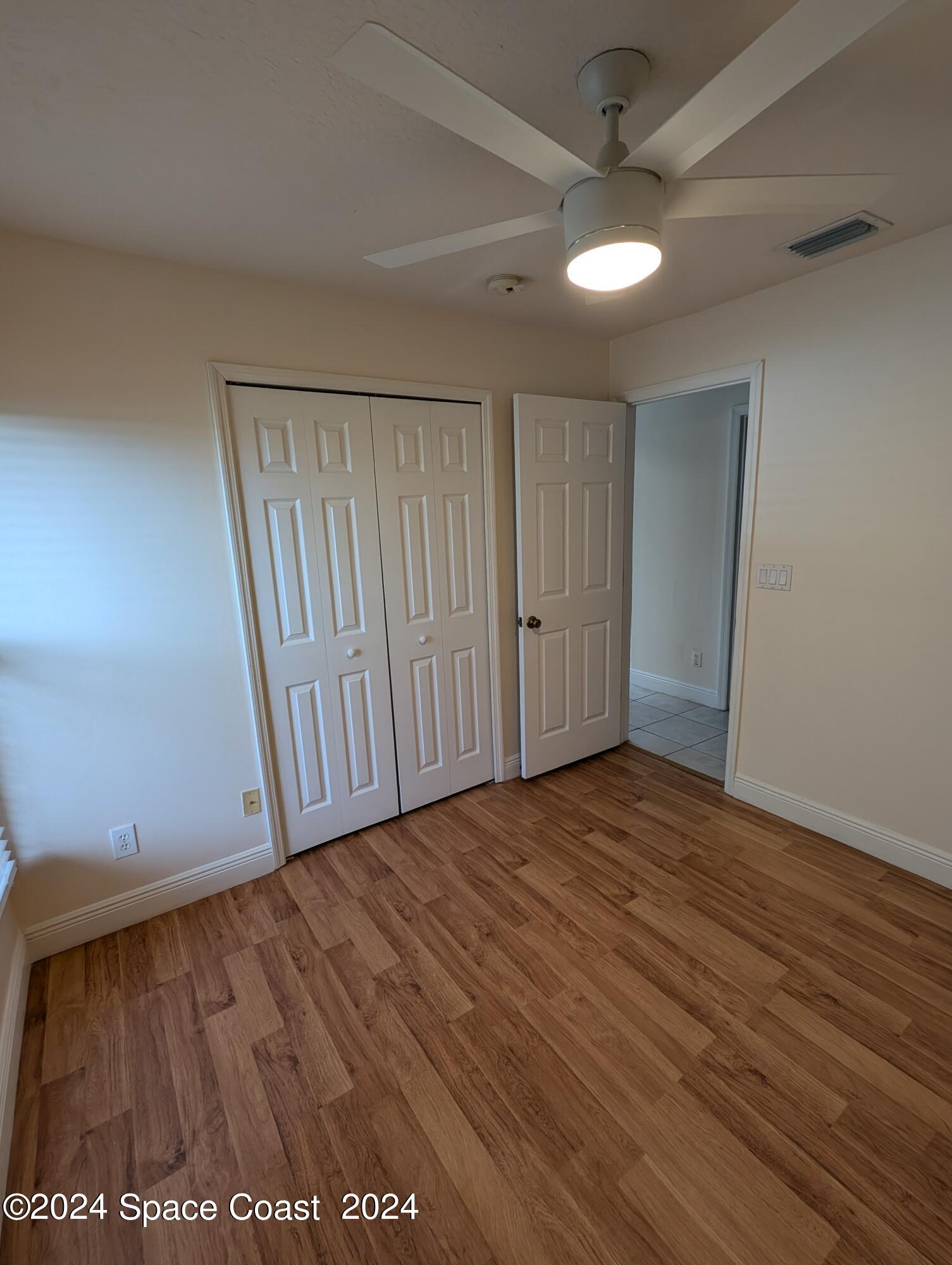 745 Luminary Circle, Unit 101 Melbourne, FL 32901 - Photo 14 of 32 a view of entryway with wooden floor