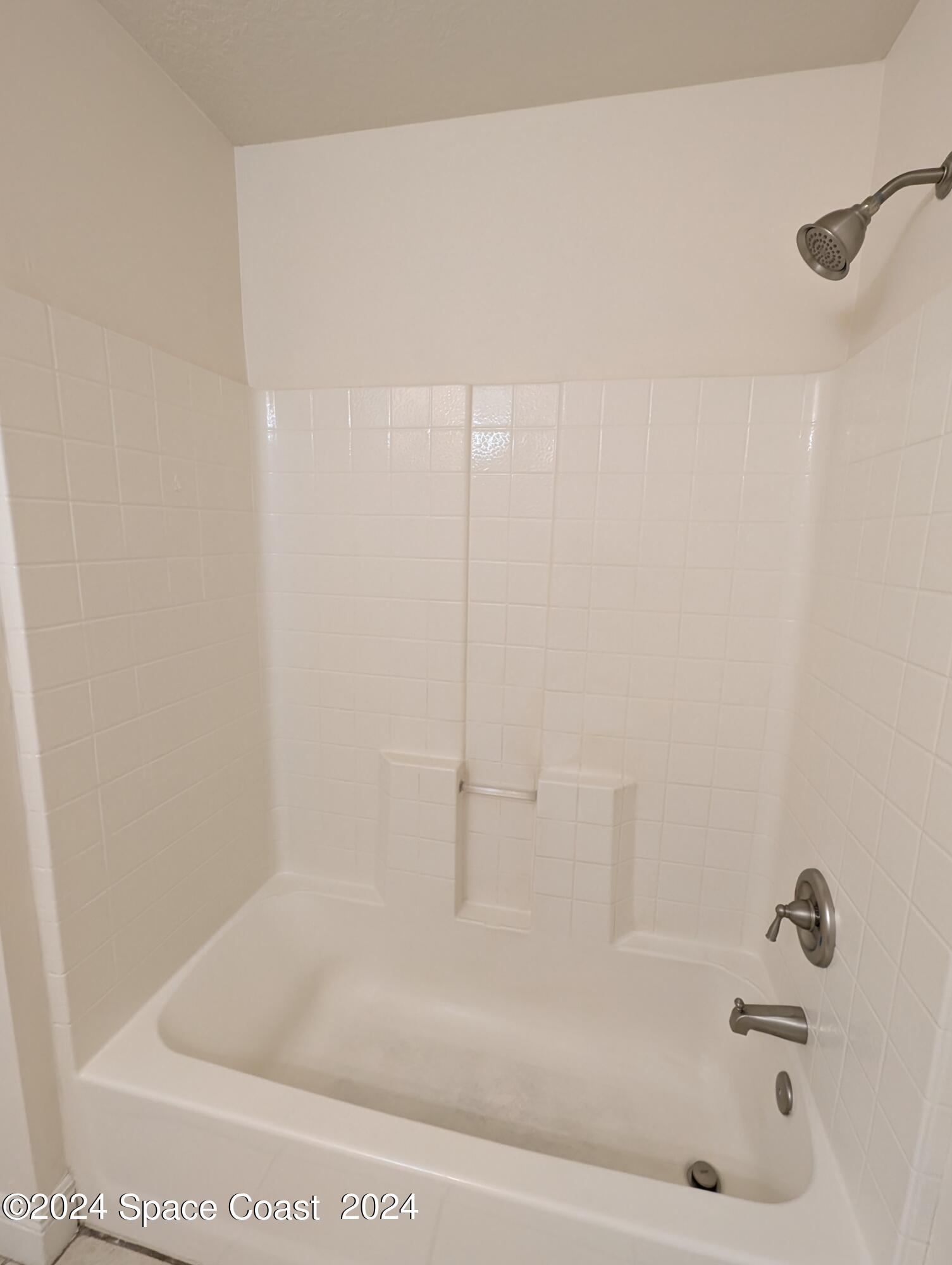 745 Luminary Circle, Unit 101 Melbourne, FL 32901 - Photo 16 of 32 a close up of a bathtub in a bathroom