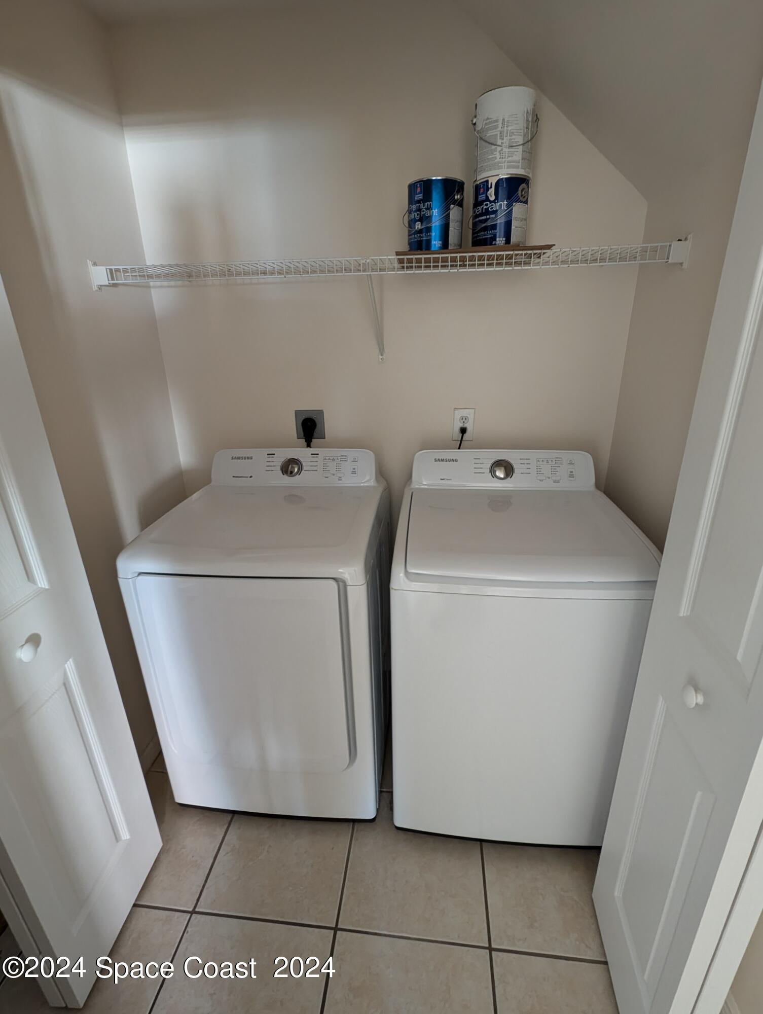 745 Luminary Circle, Unit 101 Melbourne, FL 32901 - Photo 17 of 32 a utility room with dryer and washer