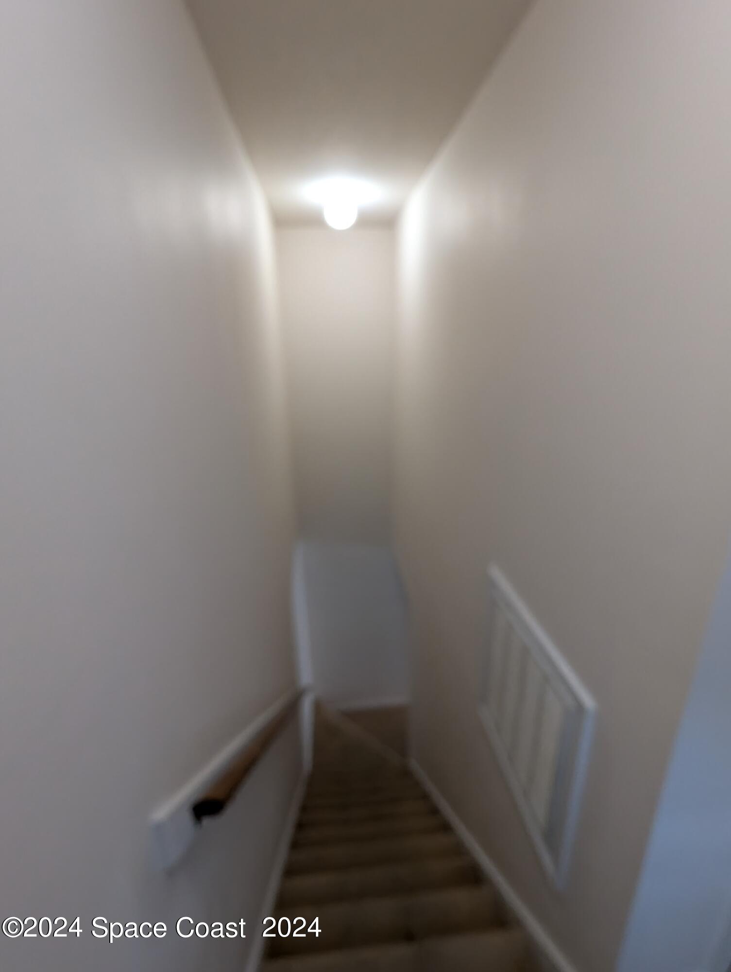 745 Luminary Circle, Unit 101 Melbourne, FL 32901 - Photo 21 of 32 a view of small space with racks on the wall