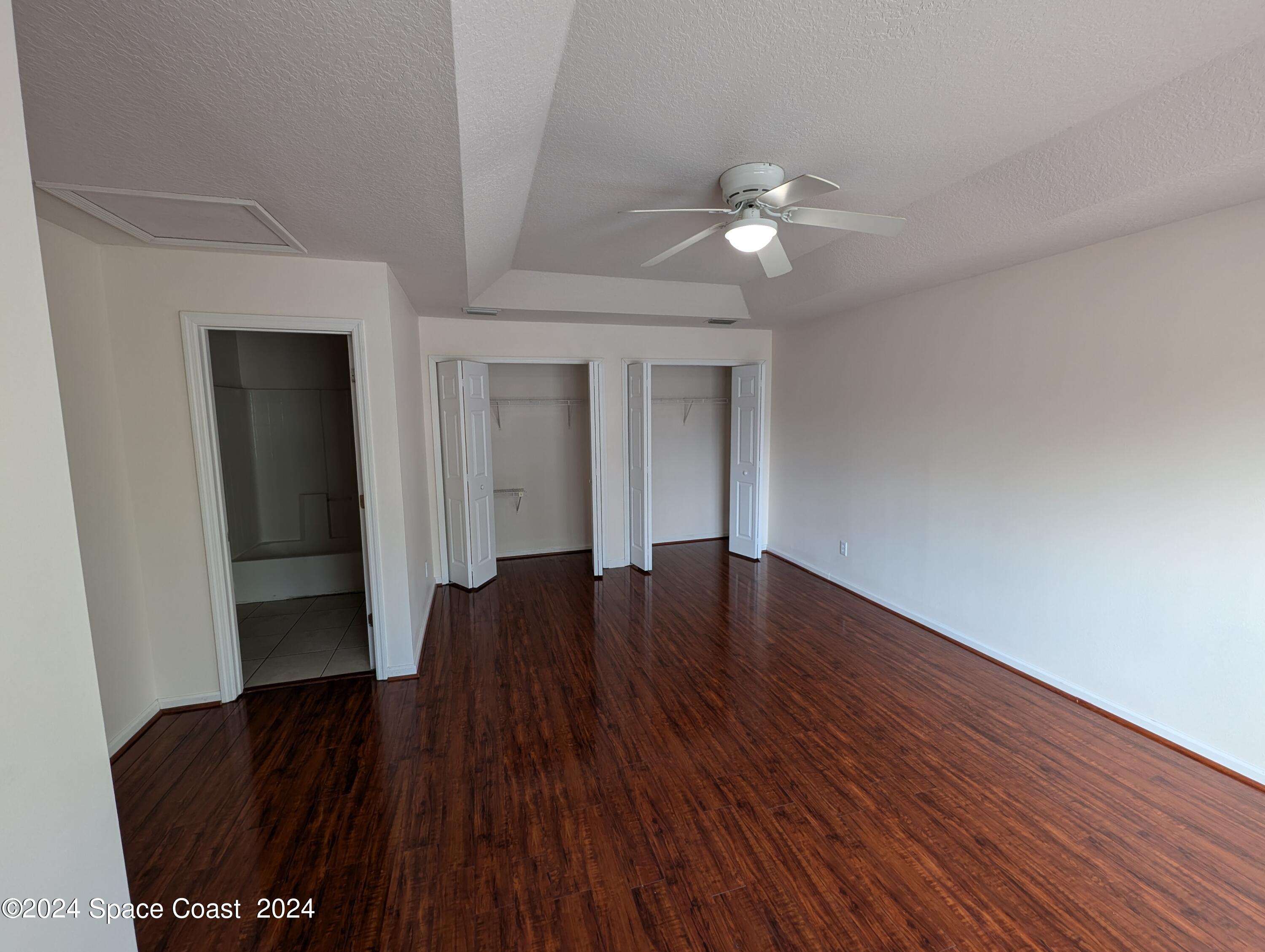 745 Luminary Circle, Unit 101 Melbourne, FL 32901 - Photo 25 of 32 a view of livingroom with hardwood floor and ceiling fan