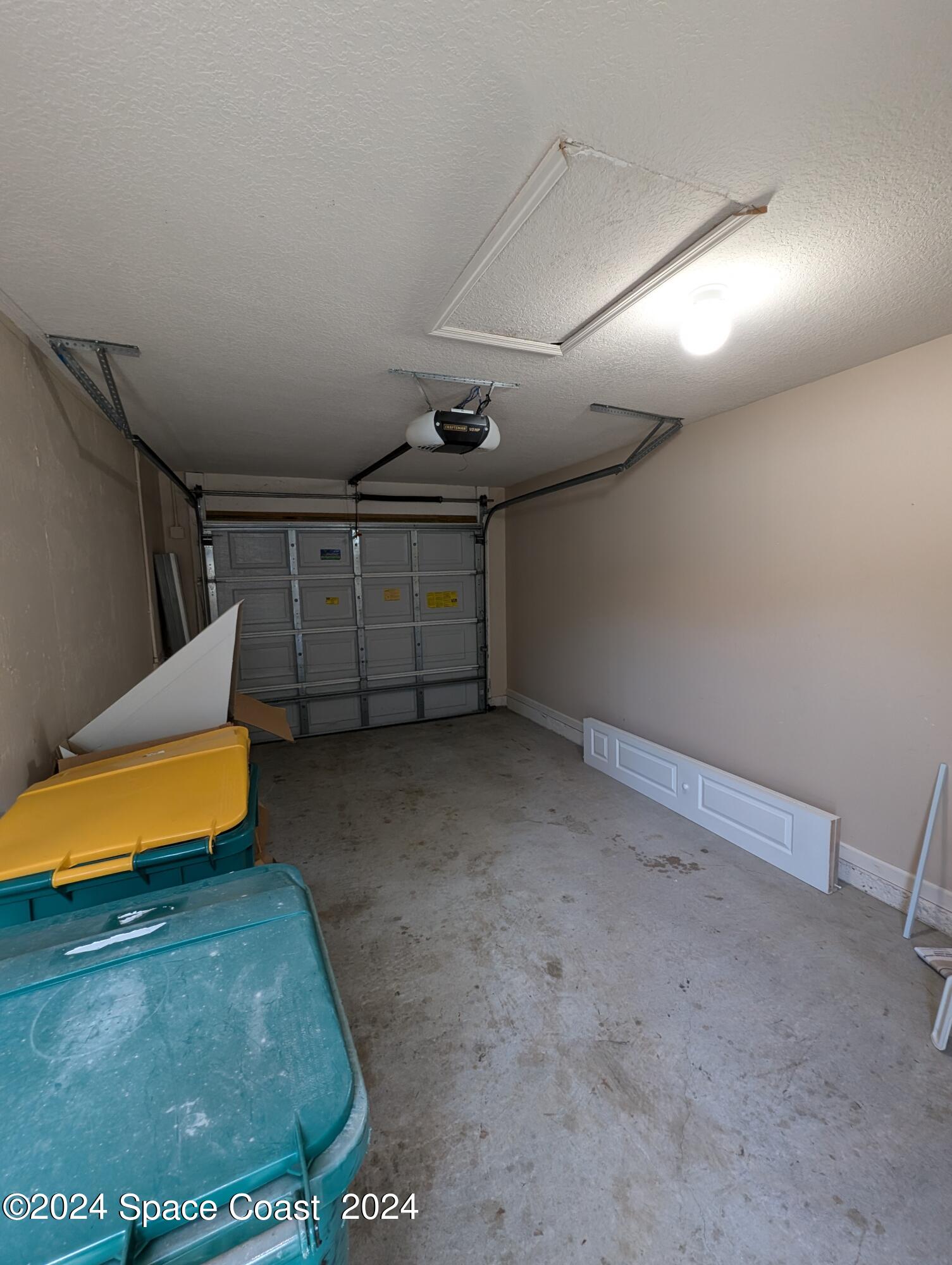 745 Luminary Circle, Unit 101 Melbourne, FL 32901 - Photo 28 of 32 a view of a garage