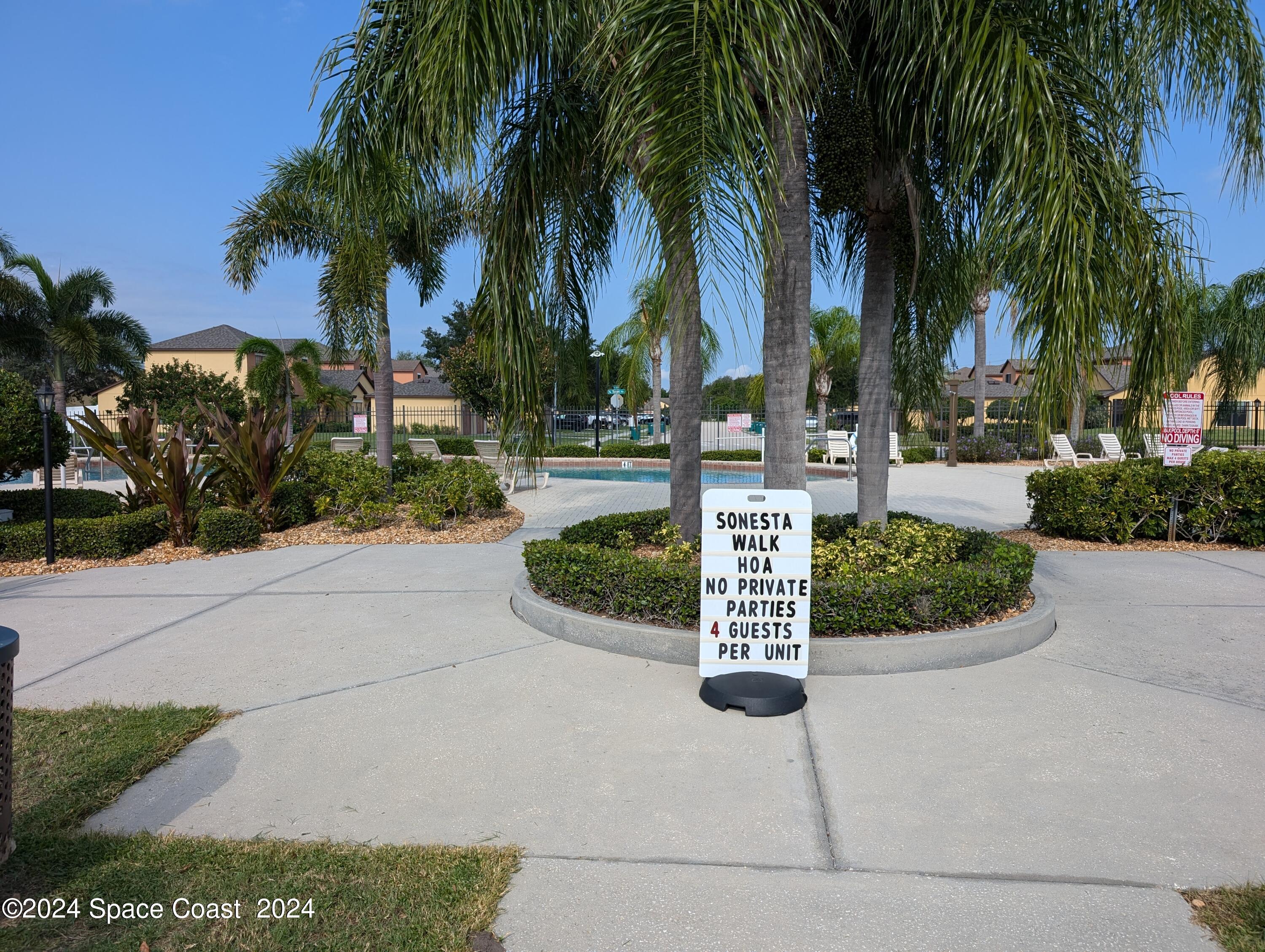 745 Luminary Circle, Unit 101 Melbourne, FL 32901 - Photo 29 of 32 a view of a yard with palm trees