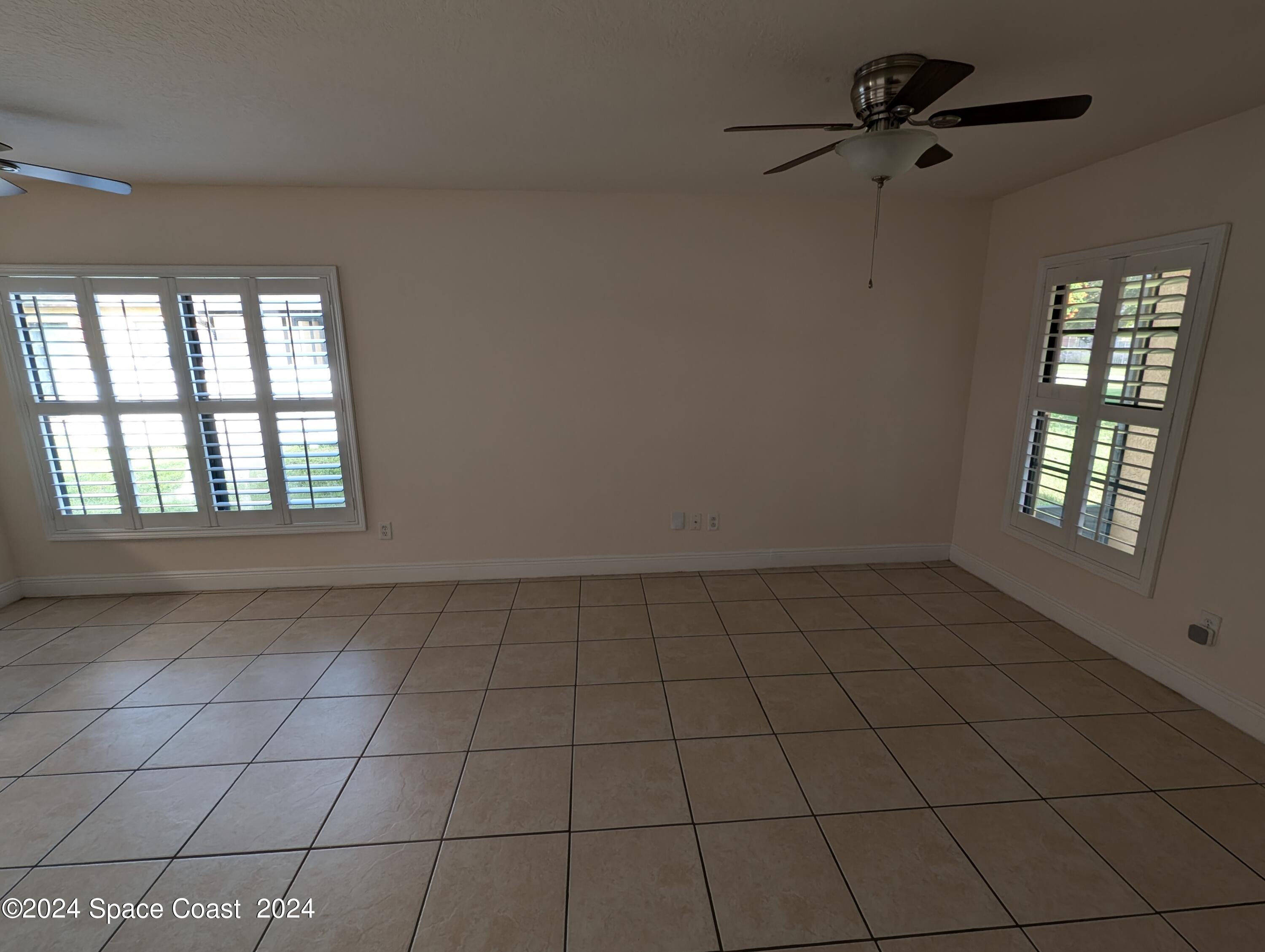 745 Luminary Circle, Unit 101 Melbourne, FL 32901 - Photo 7 of 32 a view of an empty room and window