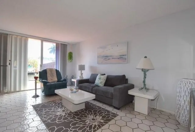 a living room with furniture and a table
