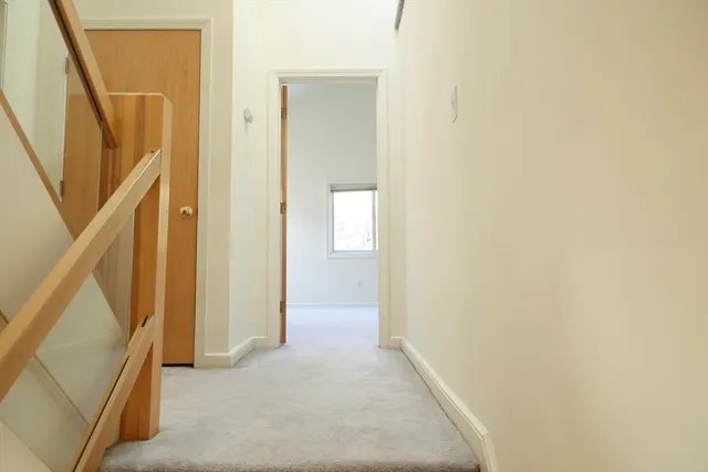 a view of a hallway with staircase