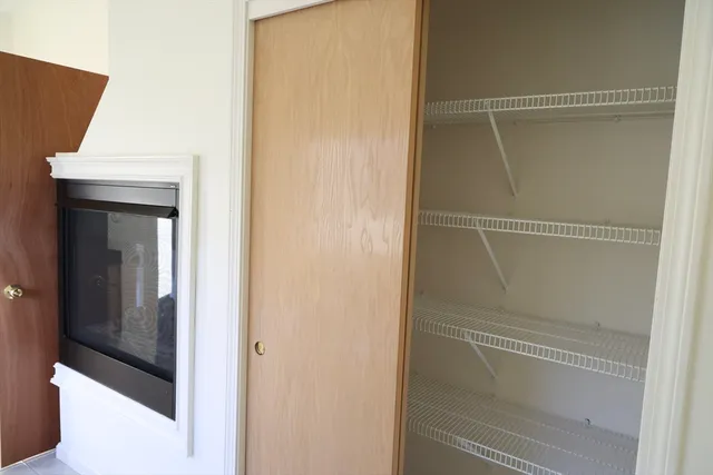 a bathroom with a glass shower door