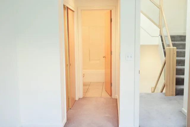 a view of a bathroom from a corridor