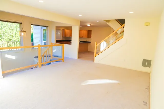a view of a livingroom with furniture and a window