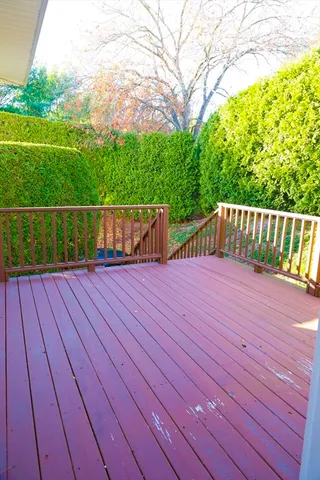 a view of balcony with wooden floor
