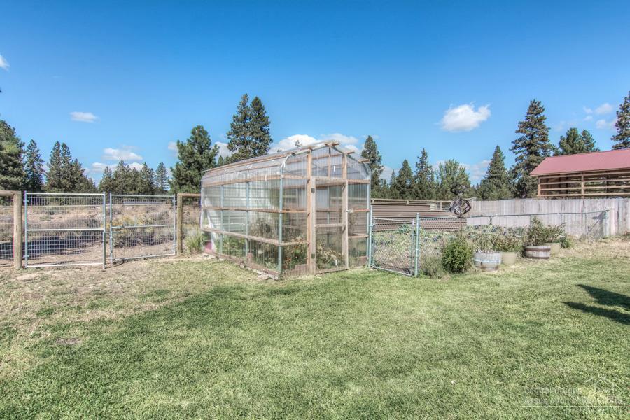 19548 Apache Road Bend, OR 97702 - Photo 19 of 25 a view of outdoor space with fenced yard and outdoor seating
