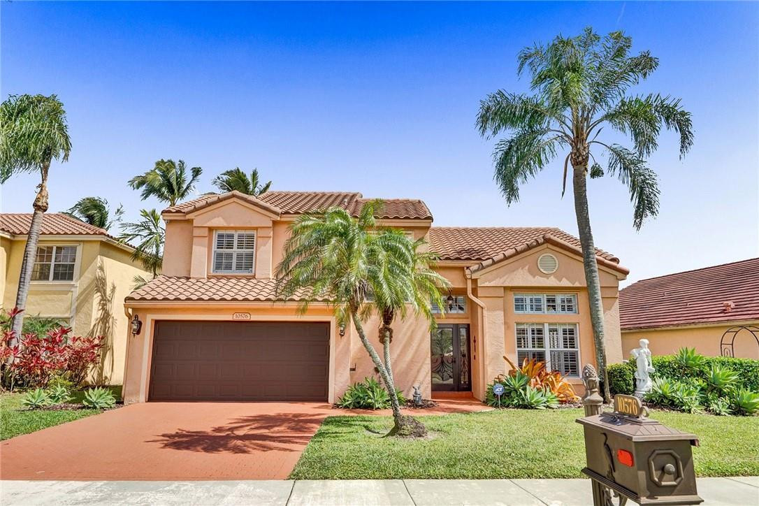 10576 Plainview Circle Boca Raton, FL 33498 - Photo 1 of 51 front view of a house with a yard