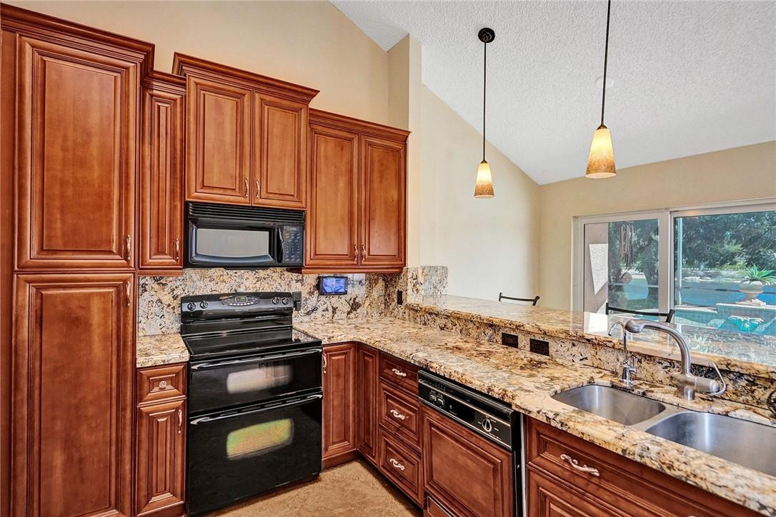 10576 Plainview Circle Boca Raton, FL 33498 - Photo 11 of 51 a kitchen with a sink appliances and cabinets