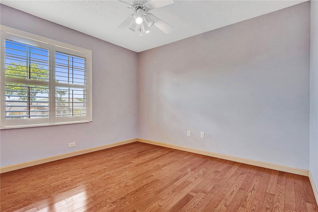 10576 Plainview Circle Boca Raton, FL 33498 - Photo 24 of 51 wooden floor in an empty room with a window