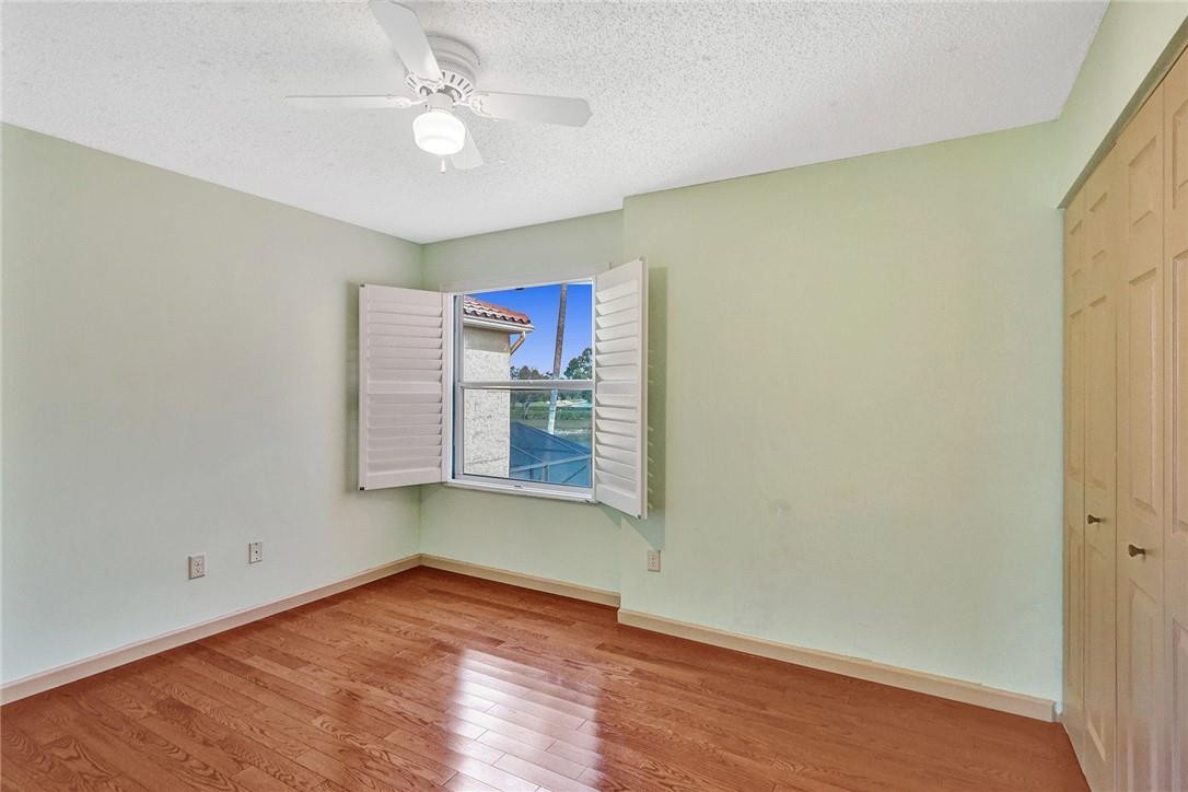 10576 Plainview Circle Boca Raton, FL 33498 - Photo 29 of 51 wooden floor in an empty room with a window