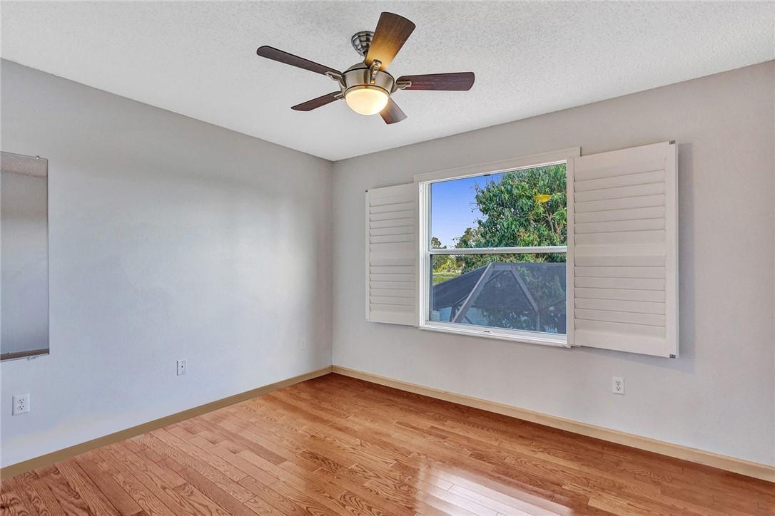 10576 Plainview Circle Boca Raton, FL 33498 - Photo 31 of 51 a view of empty room with wooden floor and fan