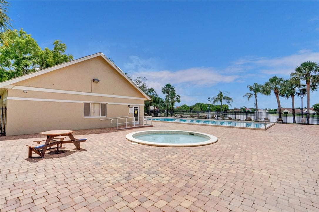 10576 Plainview Circle Boca Raton, FL 33498 - Photo 48 of 51 a view of a white house next to a yard