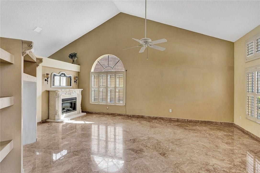 10576 Plainview Circle Boca Raton, FL 33498 - Photo 9 of 51 a view of livingroom with chandelier fan and windows