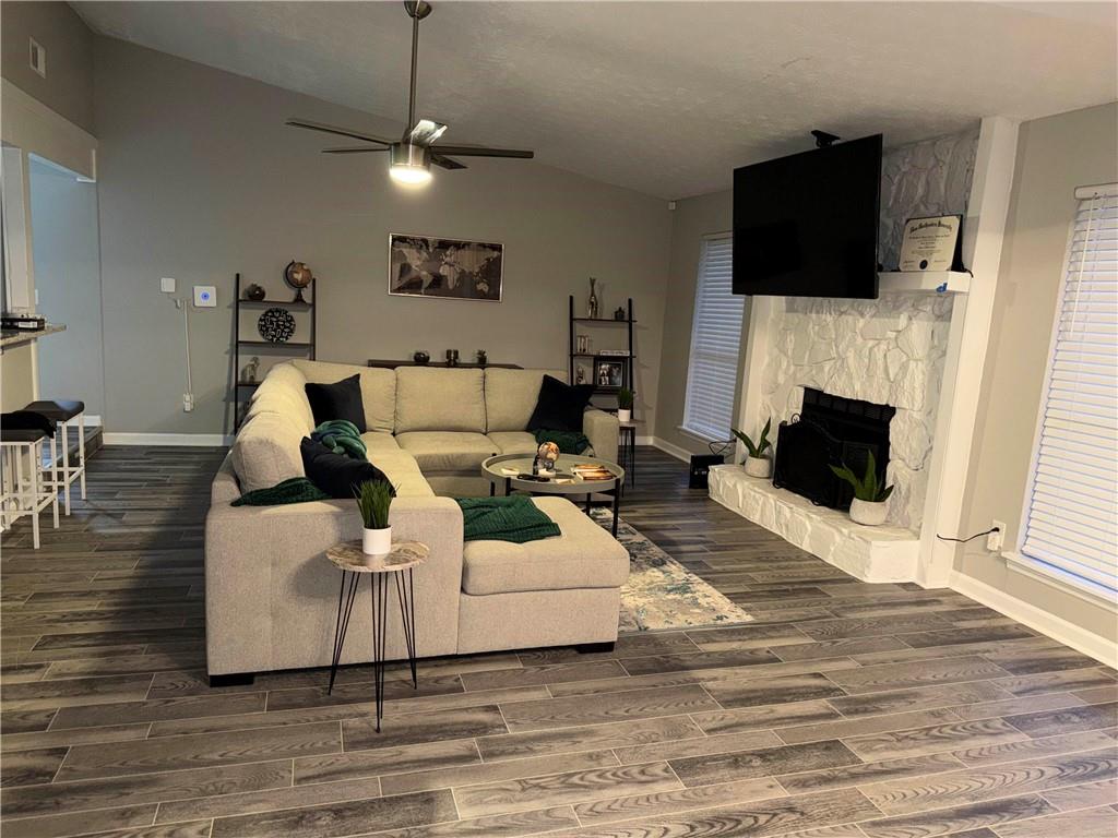 378 Park Ridge Circle Riverdale, GA 30274 - Photo 2 of 7 a living room with furniture and a flat screen tv