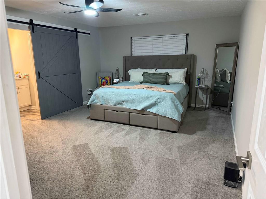 378 Park Ridge Circle Riverdale, GA 30274 - Photo 3 of 7 a bedroom with a bed and a shower