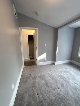 a view of a room with a hallway