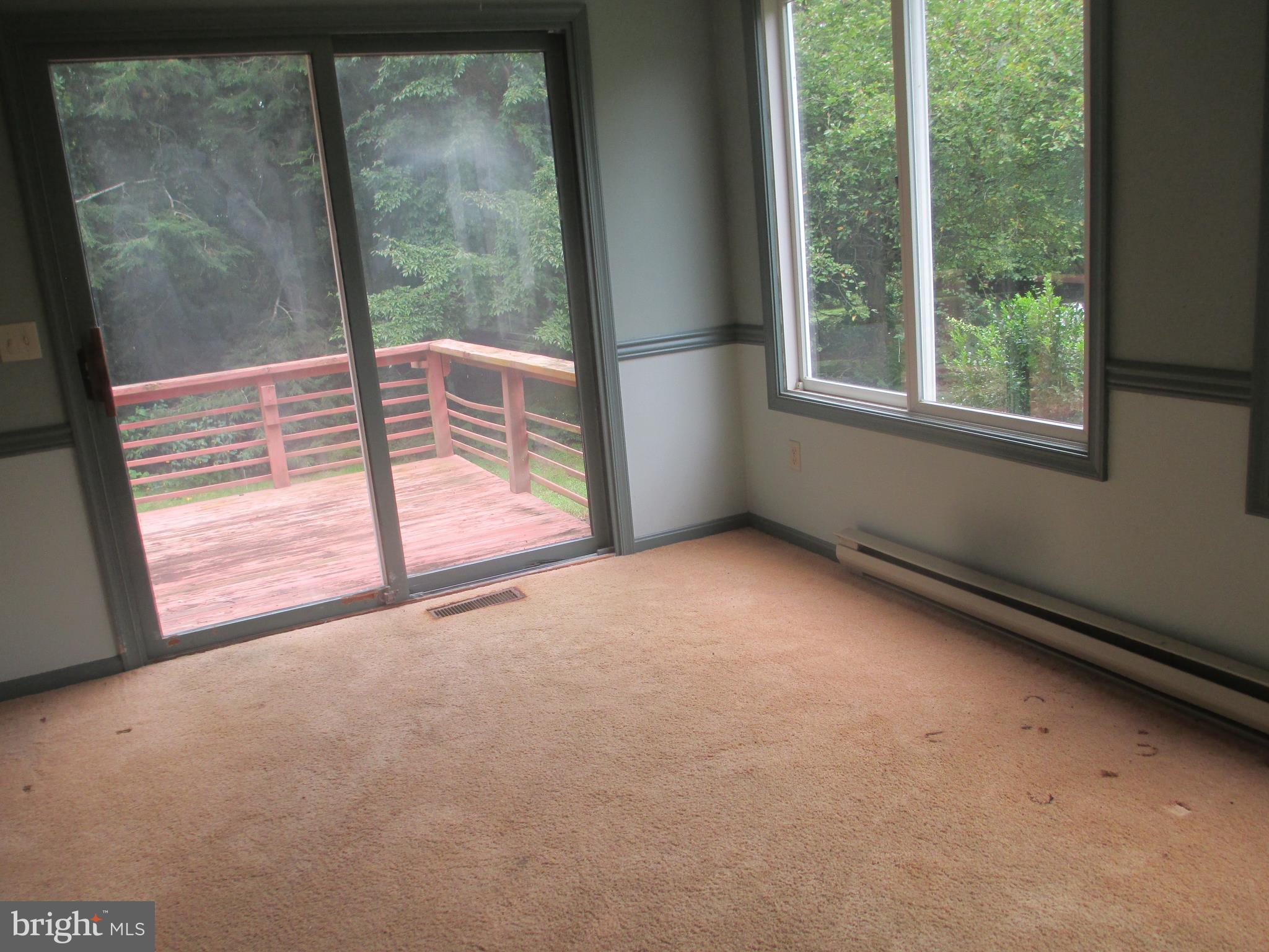 30327 Kates Point Road Trappe, MD 21673 - Photo 6 of 14 dining area with slider to deck