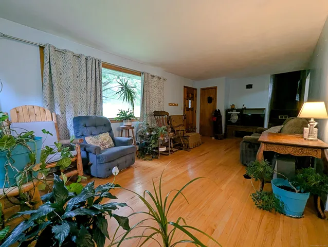 a living room with furniture and a window