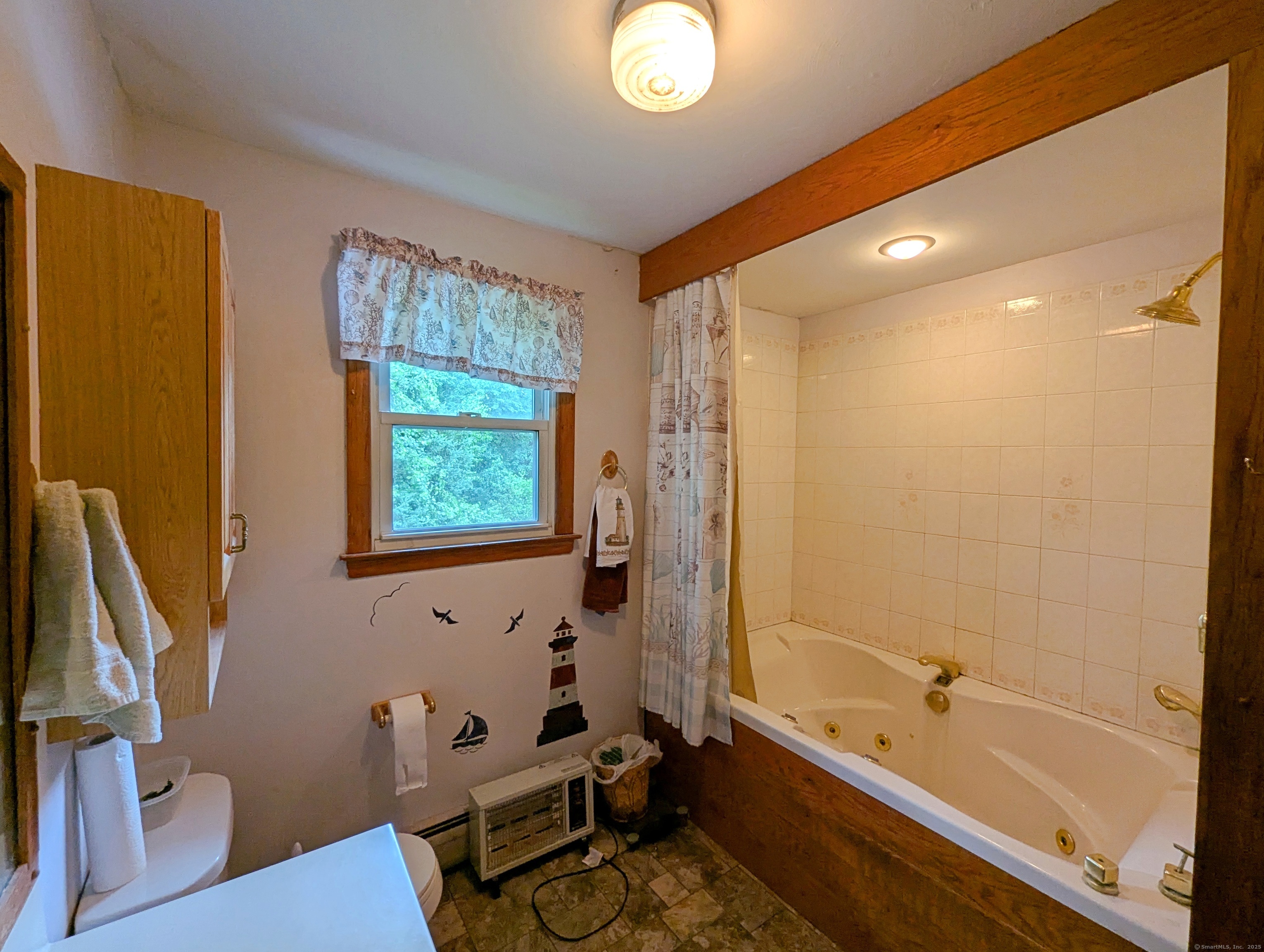 72 Morris Road Prospect, CT 06712 - Photo 13 of 27 a bathroom with a tub a sink and a window