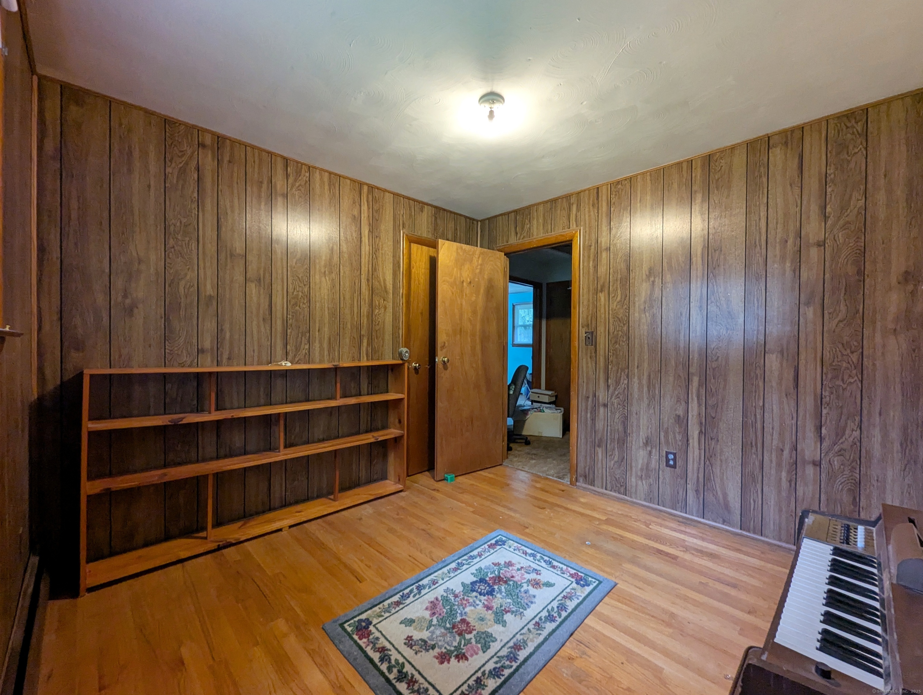 72 Morris Road Prospect, CT 06712 - Photo 16 of 27 a view of an empty room with wooden floor and a window