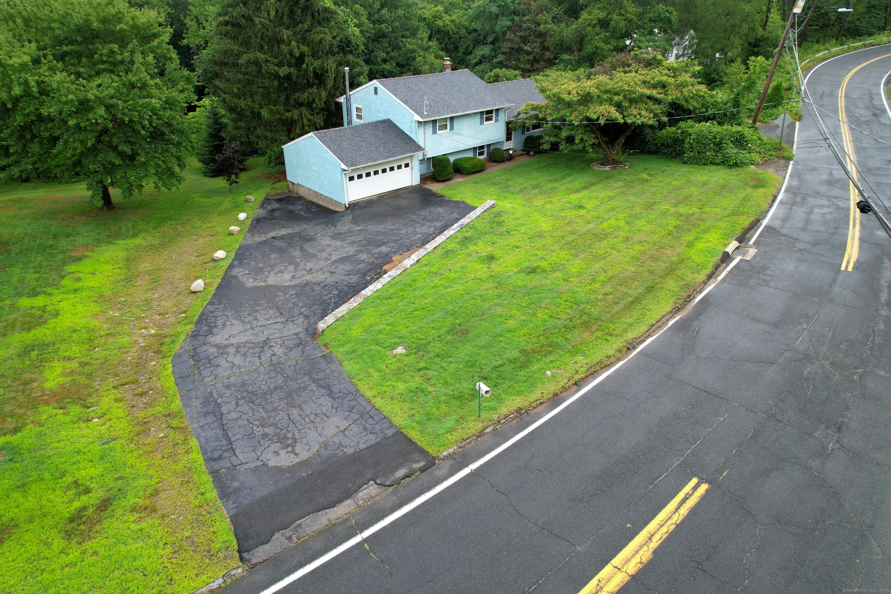72 Morris Road Prospect, CT 06712 - Photo 3 of 27 a view of a garden with lawn chairs