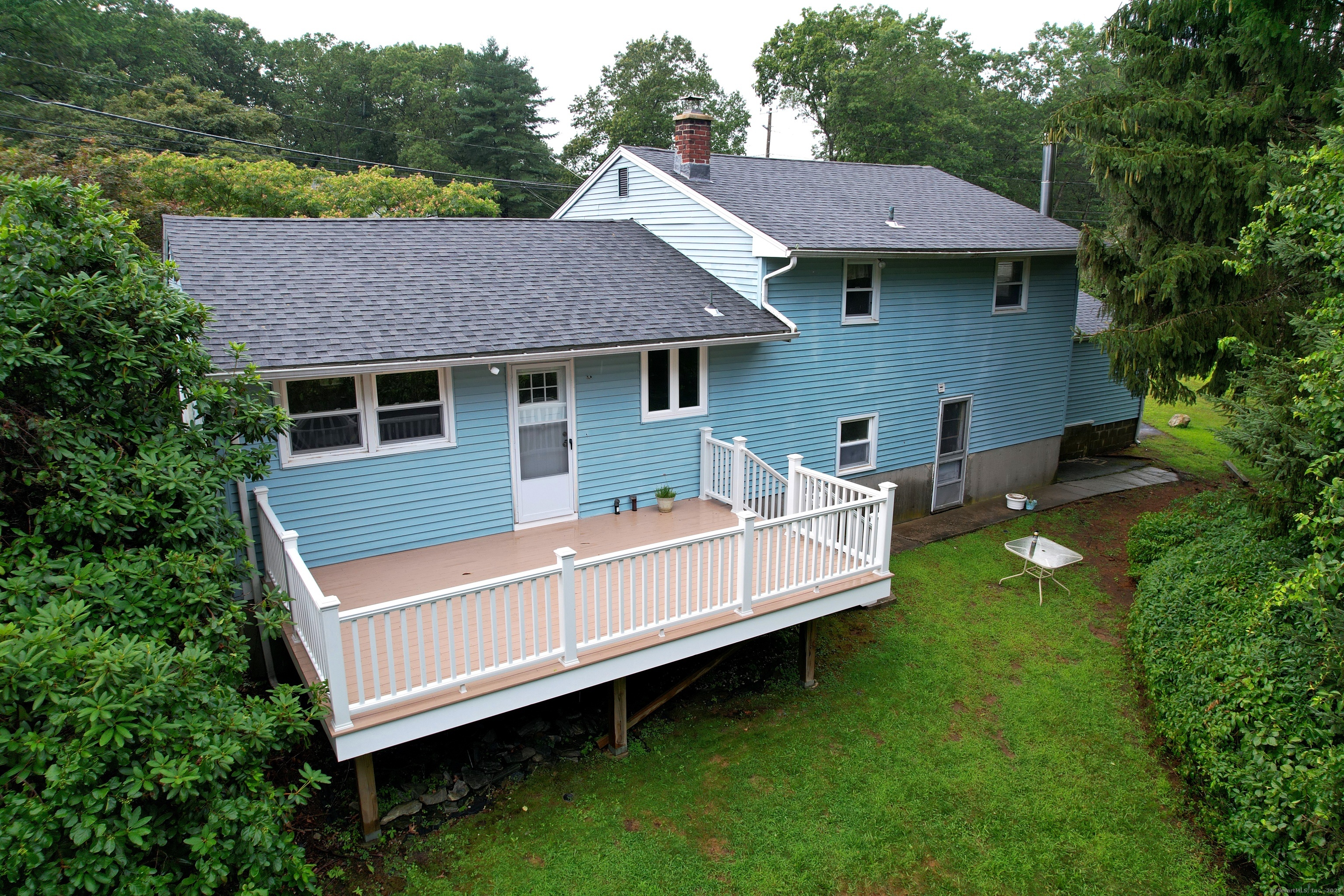 72 Morris Road Prospect, CT 06712 - Photo 4 of 27 a view of a house with a yard porch and sitting area