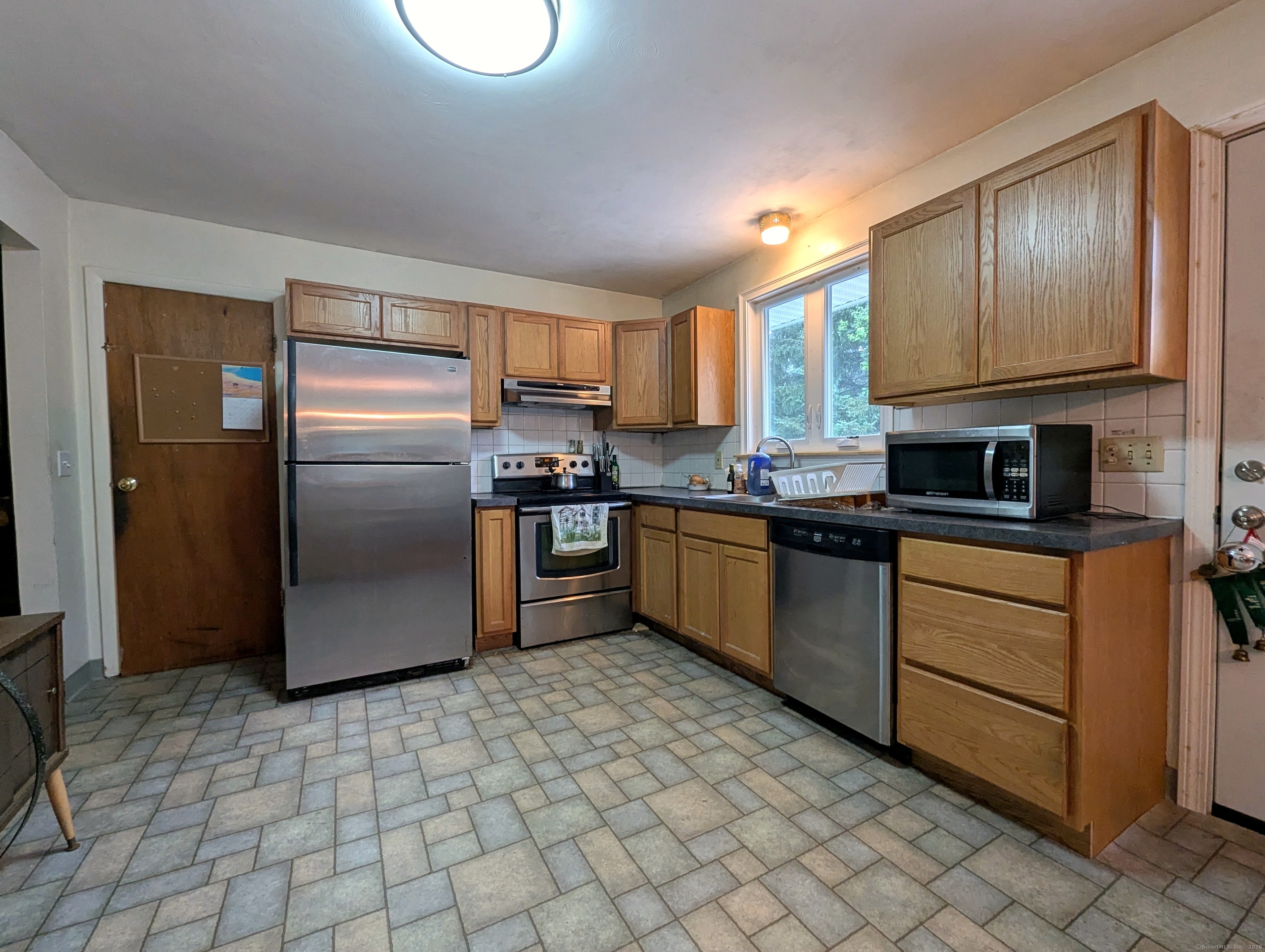 72 Morris Road Prospect, CT 06712 - Photo 5 of 27 a kitchen with stainless steel appliances granite countertop a stove a sink and a refrigerator