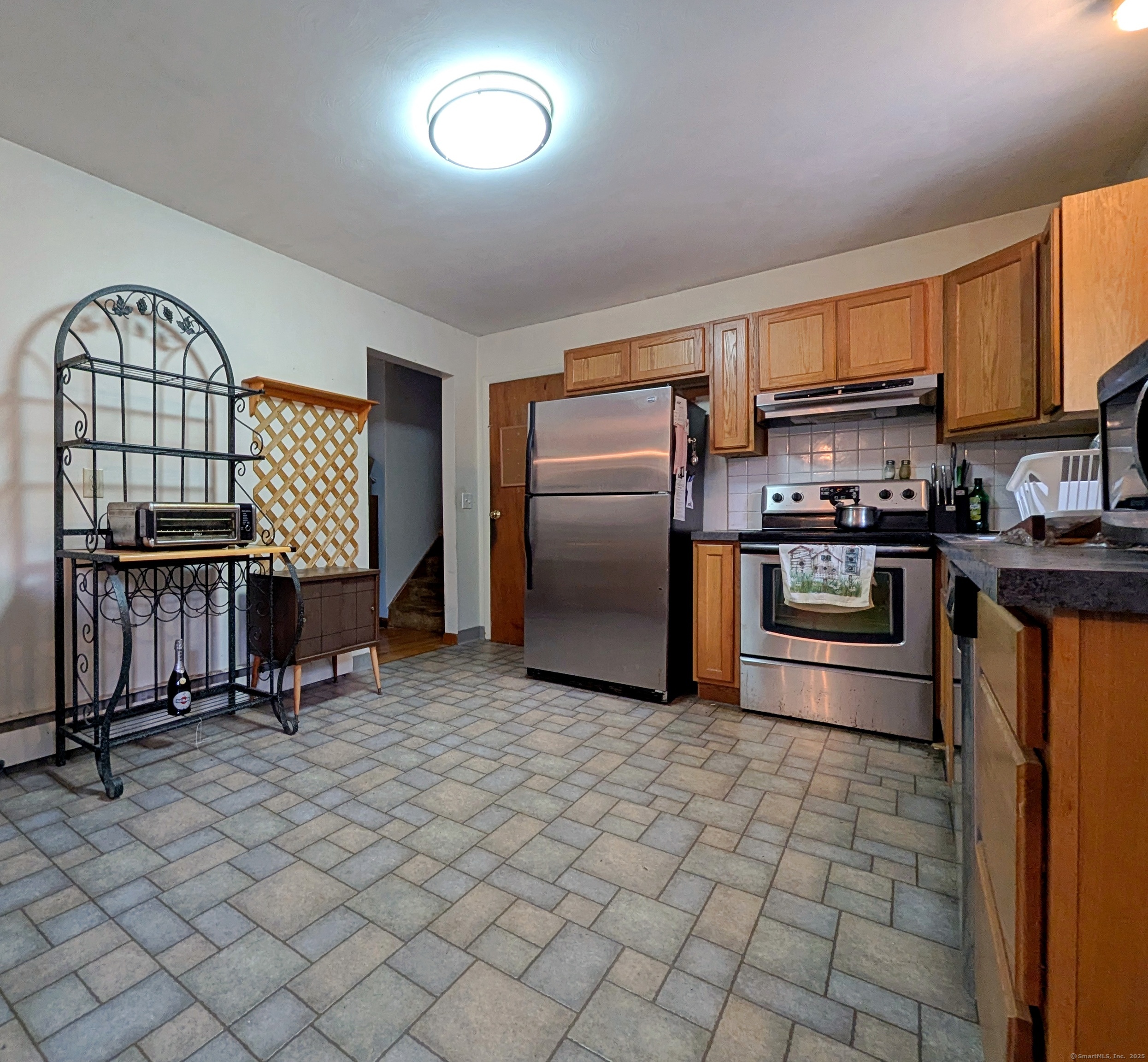 72 Morris Road Prospect, CT 06712 - Photo 6 of 27 a kitchen with stainless steel appliances granite countertop a stove a sink and a refrigerator