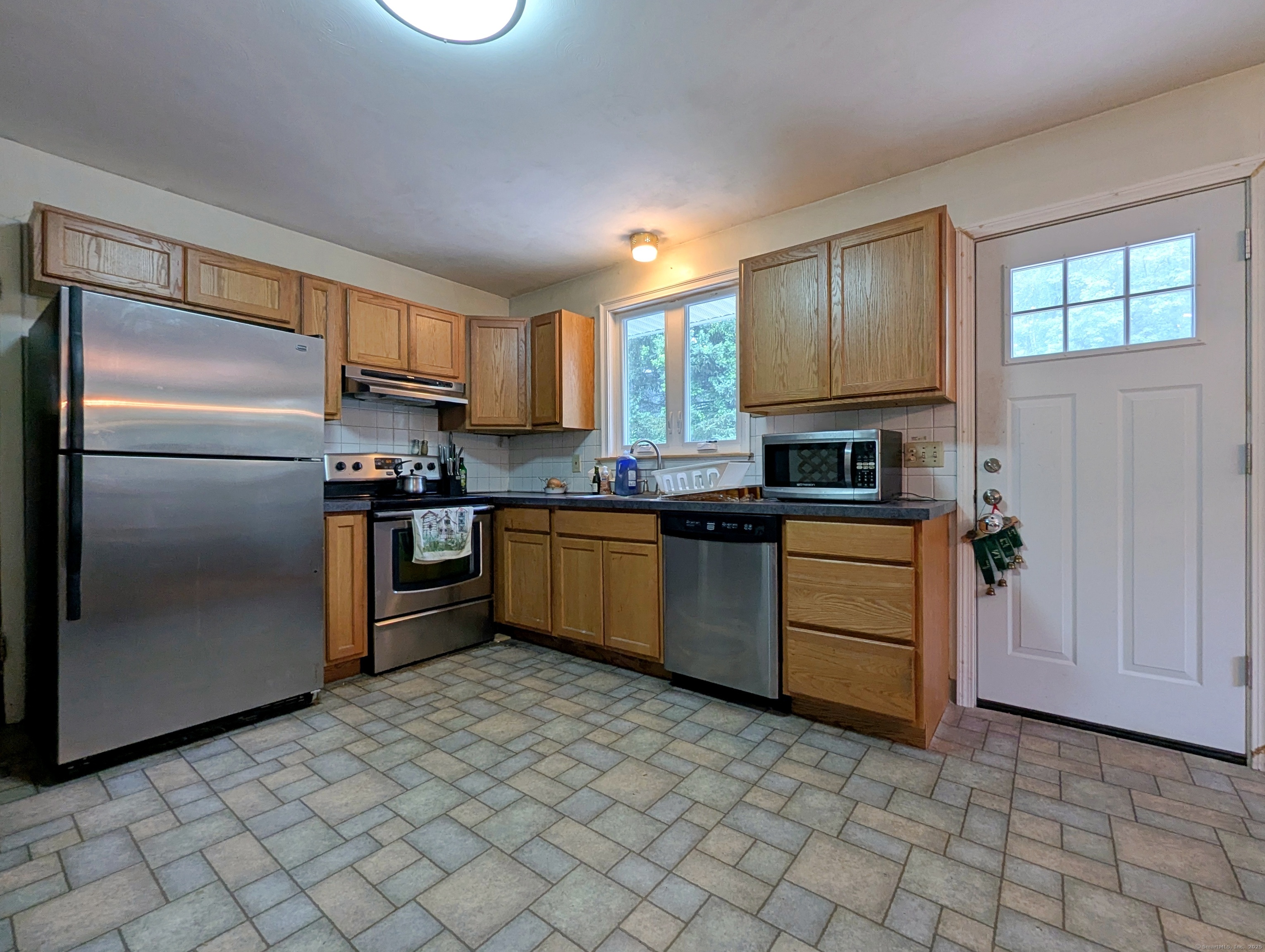 72 Morris Road Prospect, CT 06712 - Photo 8 of 27 a kitchen with stainless steel appliances granite countertop a refrigerator sink and cabinets