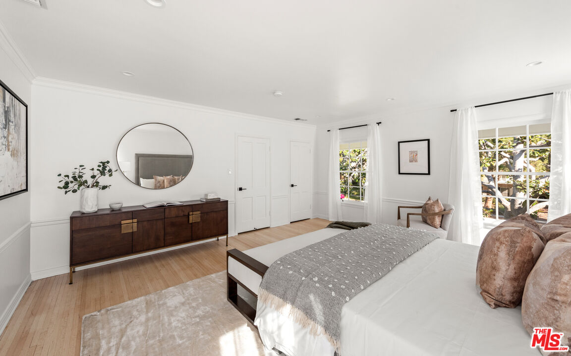 625 Sierra Drive Beverly Hills, CA 90210 - Photo 16 of 25 a bedroom with a bed and dresser