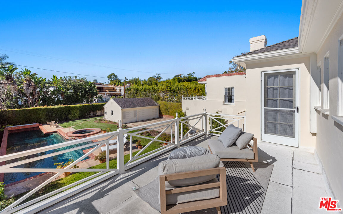 625 Sierra Drive Beverly Hills, CA 90210 - Photo 18 of 25 a view of a chairs and table in a balcony