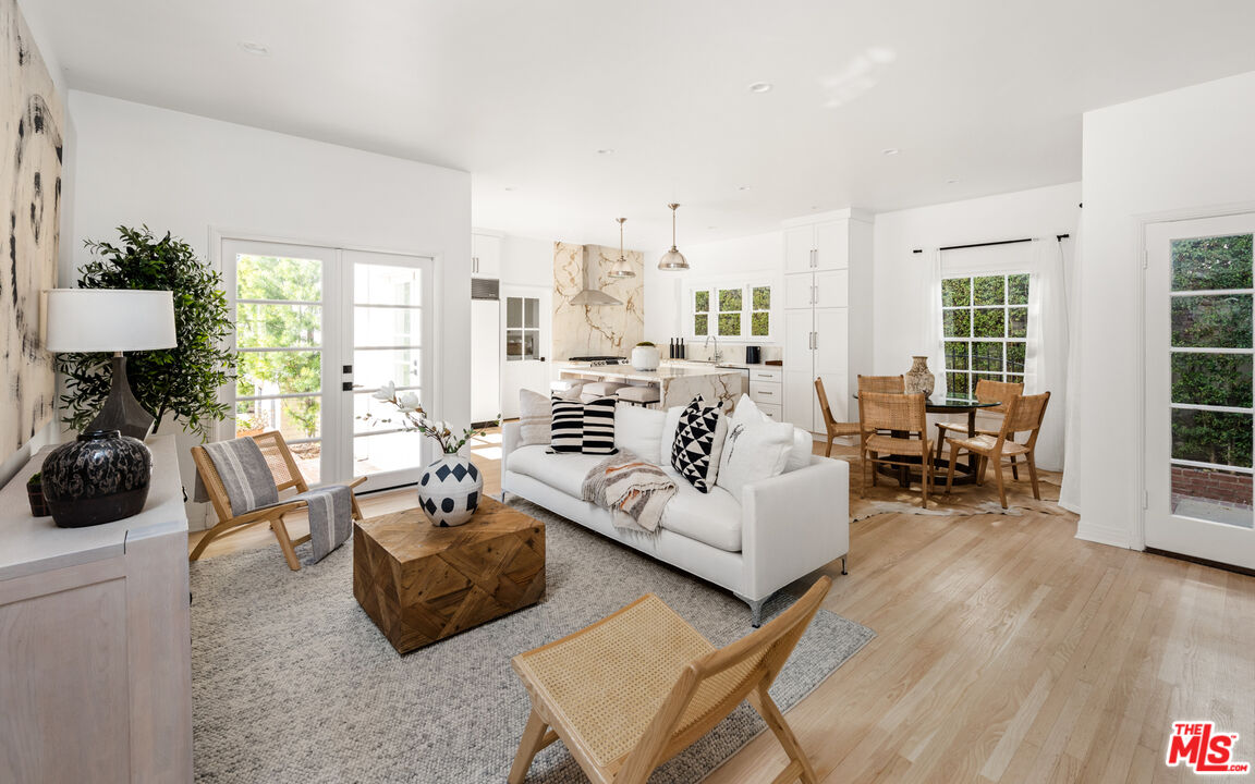 625 Sierra Drive Beverly Hills, CA 90210 - Photo 3 of 25 a living room with furniture and a table